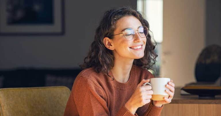 Beautiful woman relaxing and drinking hot tea