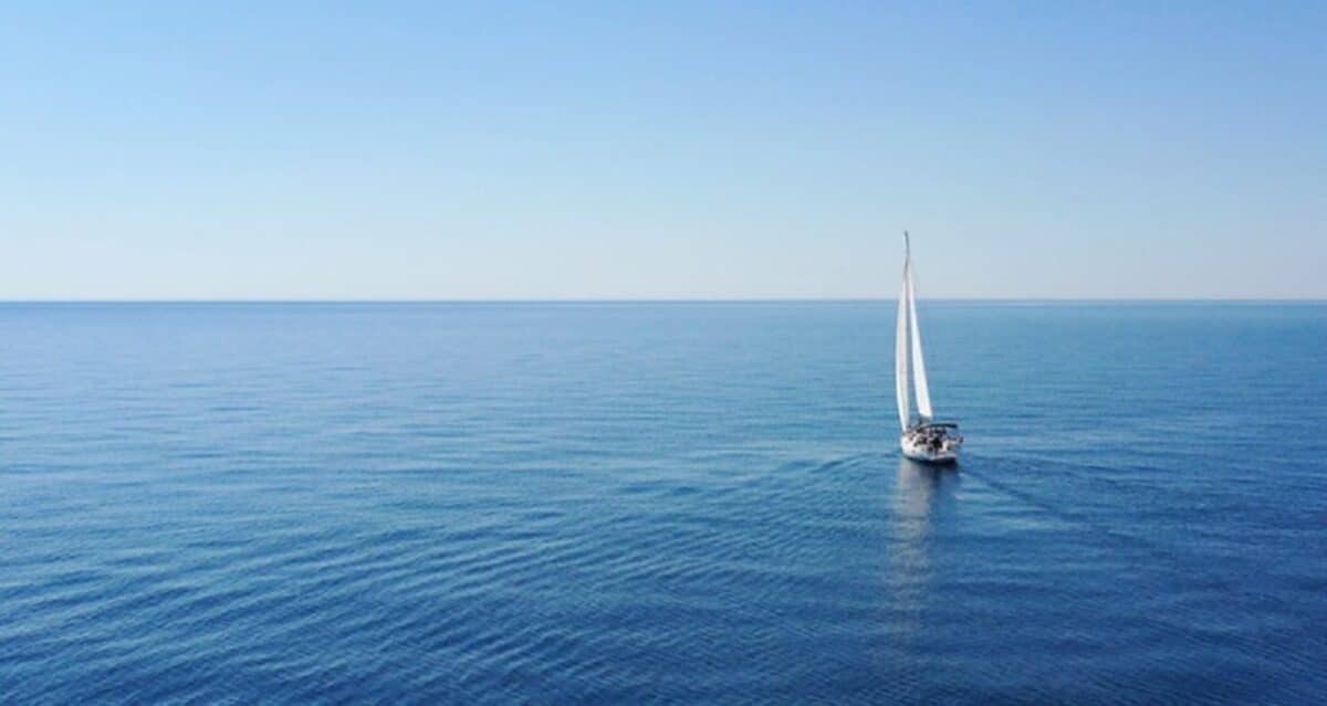 Aerial view of sailing luxury yacht at opened sea at sunny day in Croatia